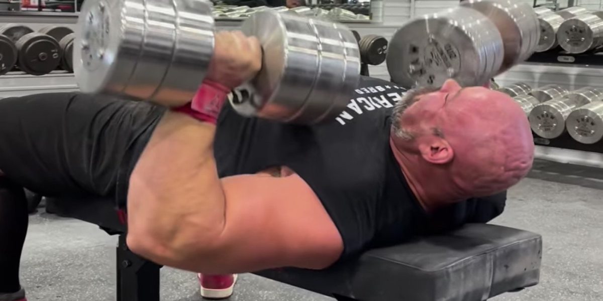 brian-shaw-benches-91-kilogram-(200-pound)-dumbbells-for-5-fast-reps-before-his-final-strongman-contest